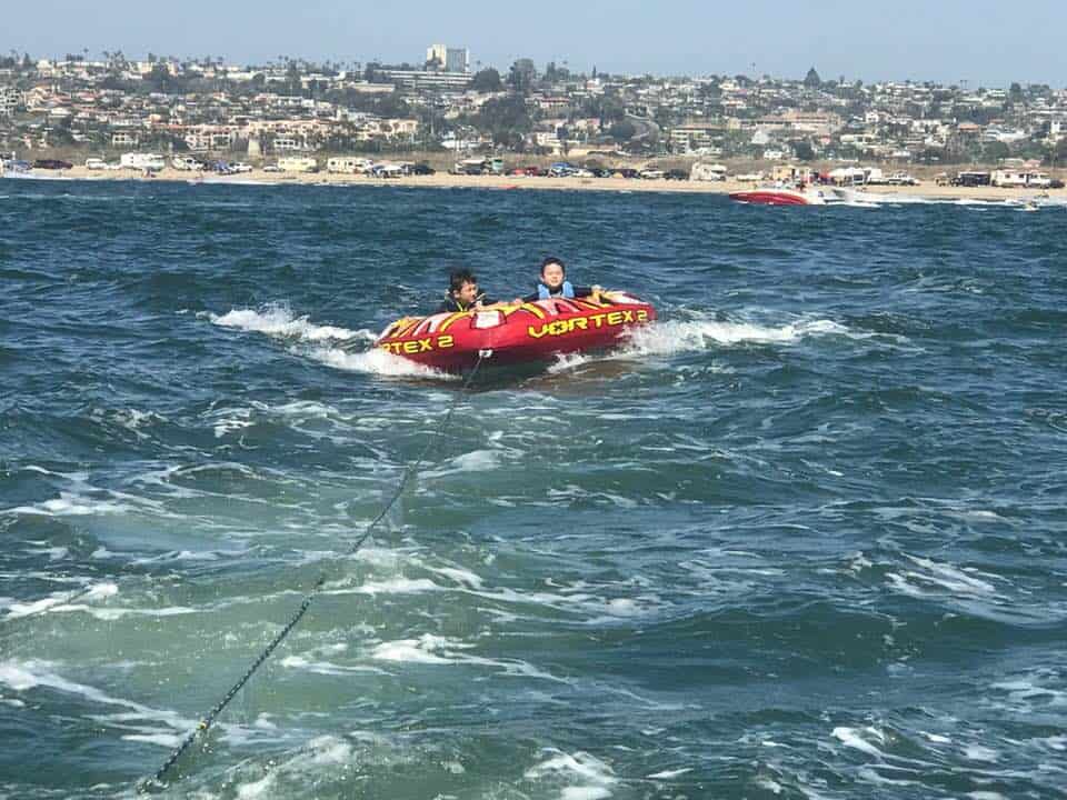kids having fun on the floaty at Campland