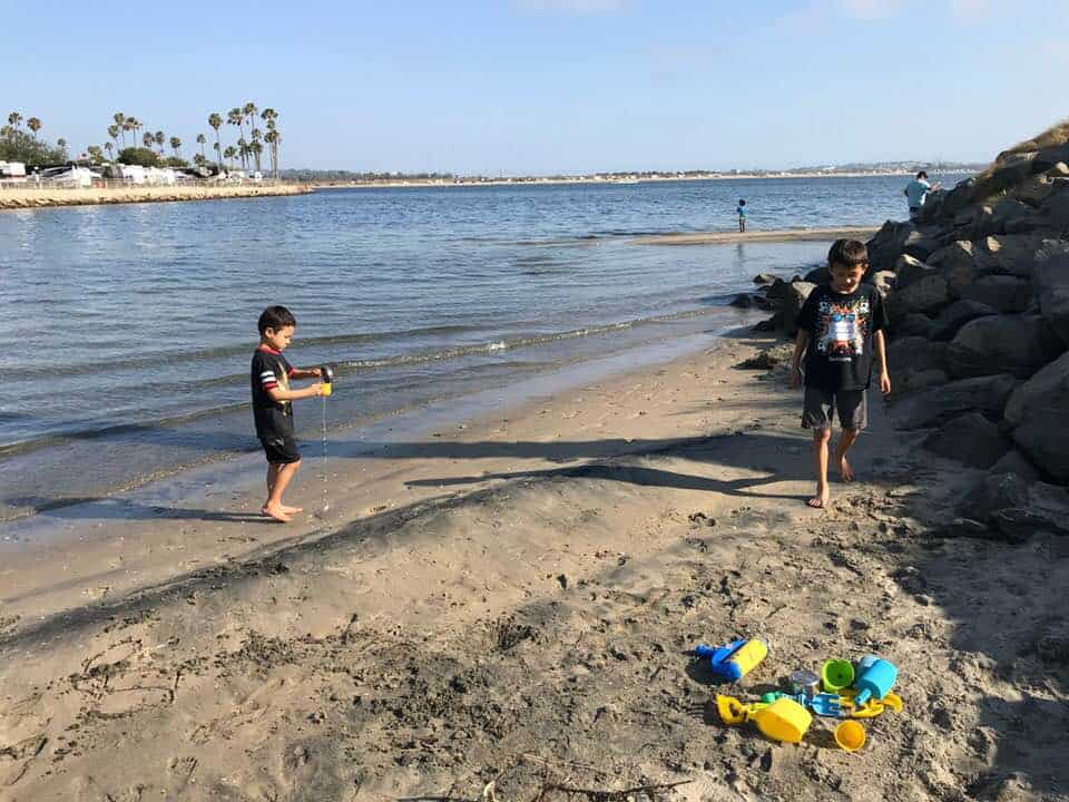 kids playing on our campsite by the water