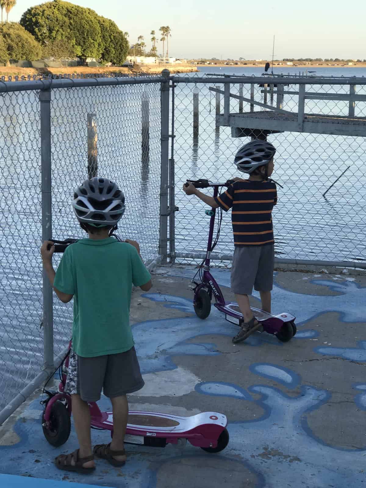 kids riding scooters at Campland