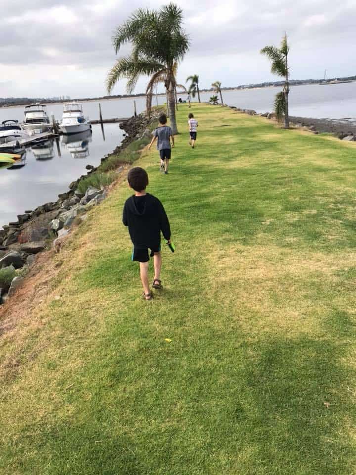 kids running on the jetty in Campland