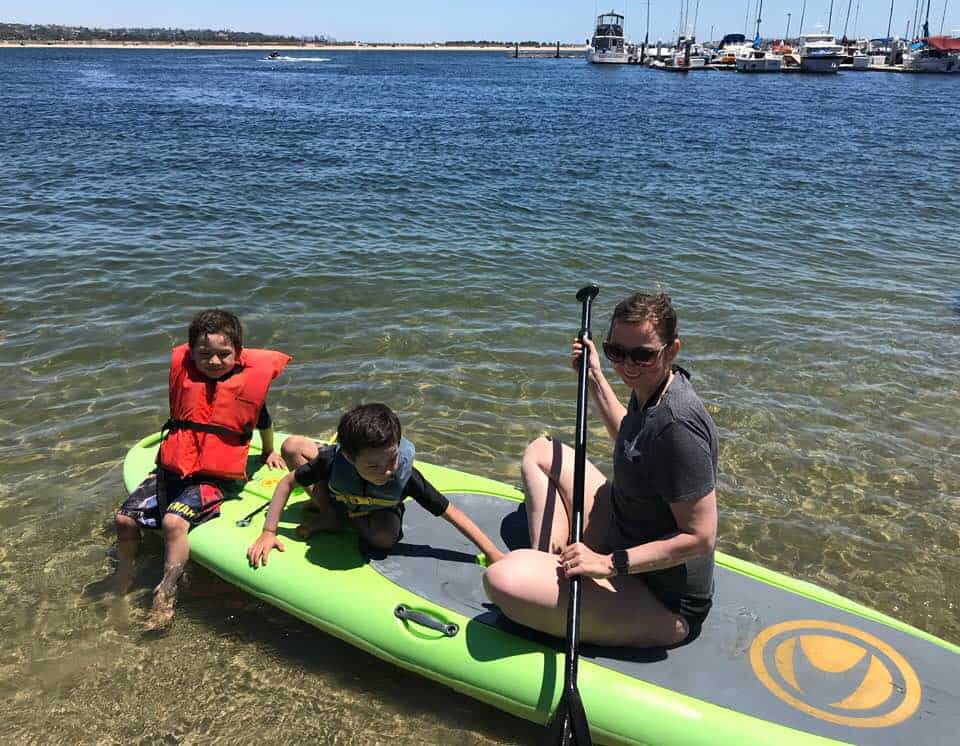 relaxing on the paddle board by the beach at Campland