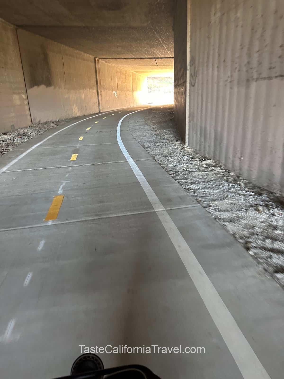 biking through a tunnel on Aliso Creek trail
