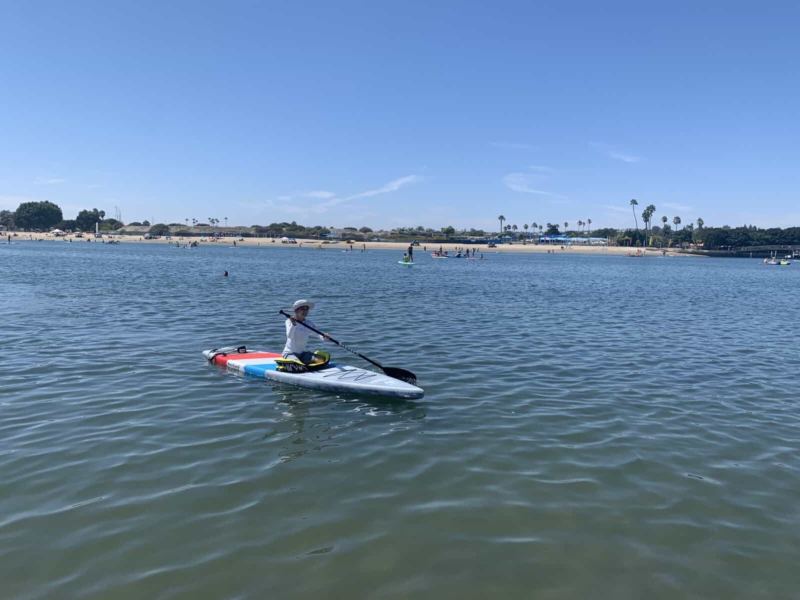my son paddleboarding in newport dunes