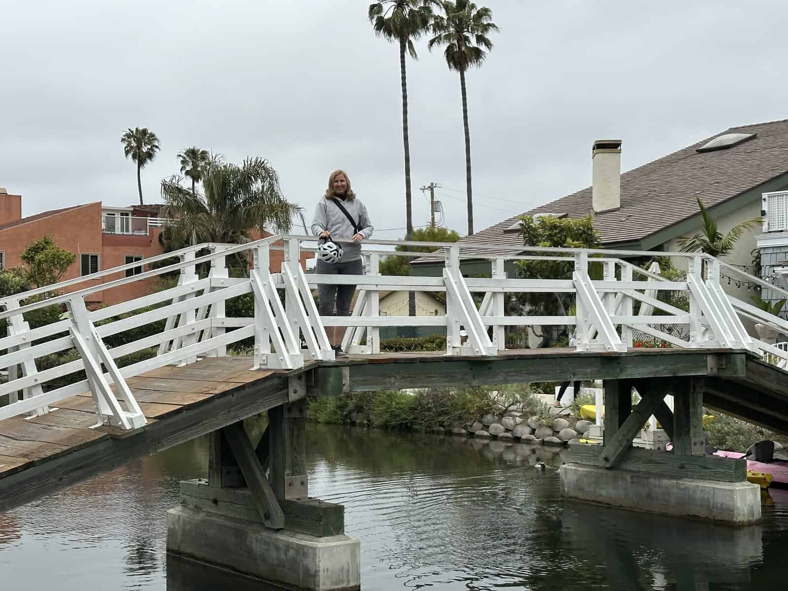 i am standing on the bridge at Venice canals